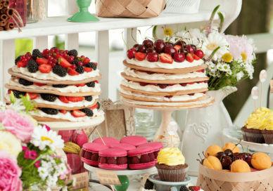 An image of a table with cakes and flowers, Great British Bake Off Experience. Parker Lee Events