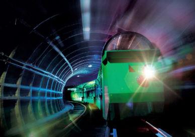 An image of a train going through a tunnel, The Postal Museum Mail Rail Ride. The Postal Museum