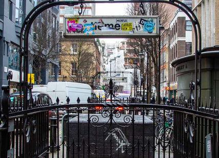 An image of a street with a black fence, Full Day Rock Music Tour. Premium Tours