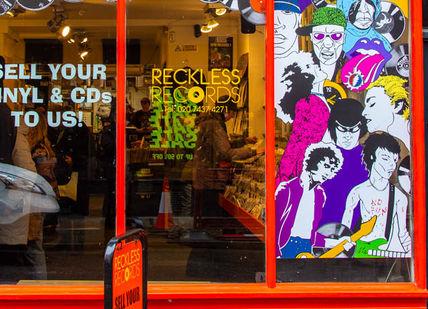 An image of a store front with a red door, Full Day Rock Music Tour. Premium Tours