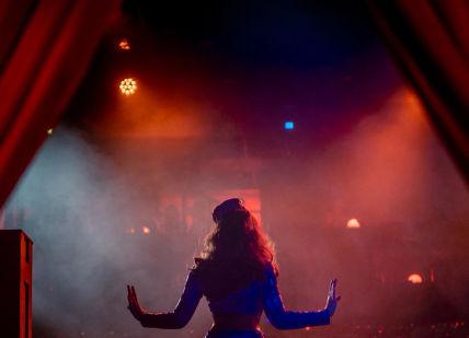 An image of a woman on stage, Proud Cabaret. Proud Cabaret