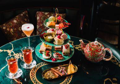 An image of a table with tea and desserts, Champagne afternoon tea. Qavali