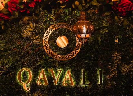 An image of a floral wall with candles and candles, Wine Pairing Lunch at Qavali. Qavali