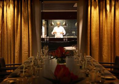 An image of a chef in a restaurant setting, Private Four-Course Dinner. Quilon