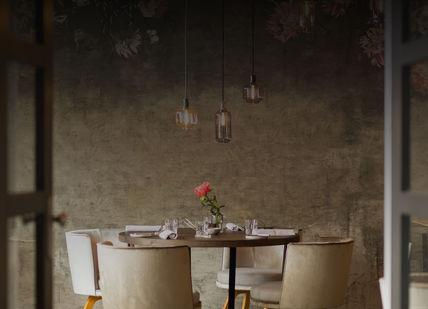 An image of a table and chairs in a restaurant, Tasting menu dinner. Restaurant Vermeer Amsterdam