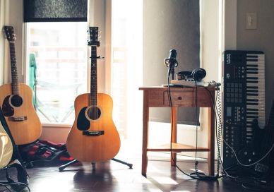 An image of a room with guitars and a guitar, Private music lesson series. Rhythm Room Music School