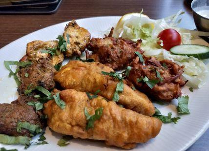 An image of a plate of food on a table, Private Royal Mile Old Town Tour and Indian Dinner. Rishi's Edinburgh Tours