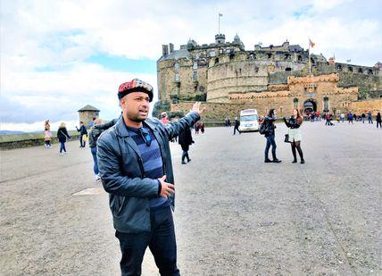 An image of a man flying a kite, Private Royal Mile Old Town Tour and Indian Dinner. Rishi's Edinburgh Tours