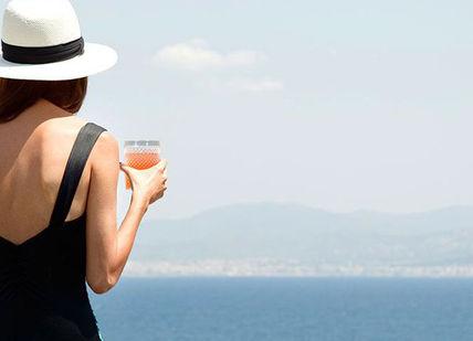 An image of a woman in a black dress, Heaven In Mallorca Romantic Getaway Tour. On The Road- Spain