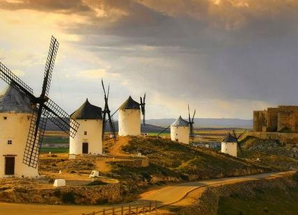 An image of a windmill and a castle, Pure Spain Self Driving Holiday. On The Road- Spain