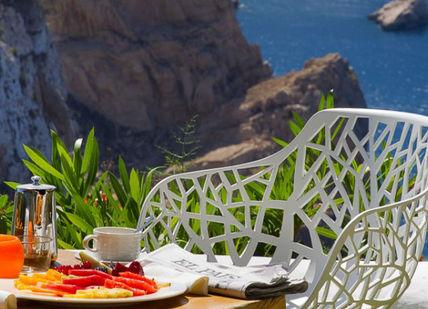 An image of a table with food and flowers, Romantic Getaway Tour In Alicante And Ibiza. On The Road- Spain