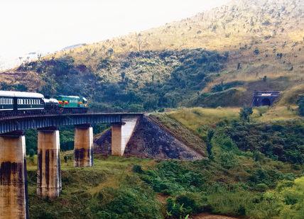 An image of a train going over a bridge, Train Journey through the Heart of Africa. Rovos Rail