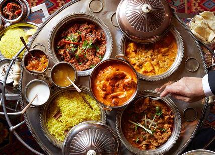 An image of a table full of food, Gourmet Experience with Chef Kumar. The Rubens at the Palace - The Curry Room
