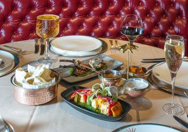 An image of a table setting with a variety of food, Three-Course Menu. The Rubens at the Palace - The Curry Room