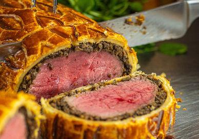 An image of a meat wellington roll, Beef Wellington Masterclass. The Rubens at the Palace - The English Grill