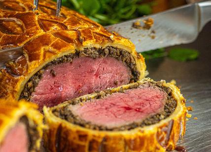 An image of a meat wellington roll, Beef Wellington Masterclass. The Rubens at the Palace - The English Grill