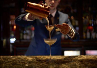 An image of a man making a drink, Matt's immersive cocktails. The Rubens at the Palace - The New York Bar