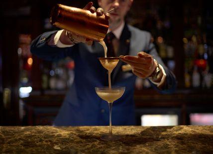 An image of a man making a drink, Matt's immersive cocktails. The Rubens at the Palace - The New York Bar
