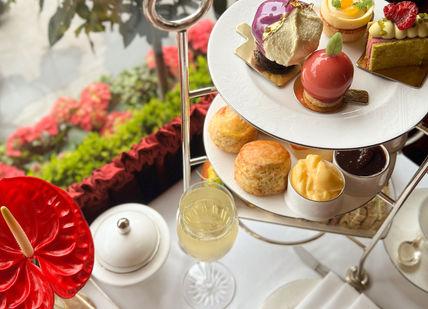 An image of a table with a tray of food, Royal Afternoon Tea. The Rubens at the Palace - The Palace Lounge