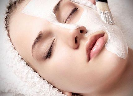 An image of a woman getting her face massage, Santi Glow Facial. Santi Spa London