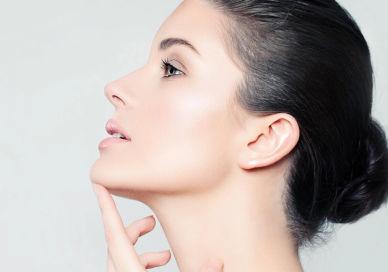 An image of a woman with her hand on her chin, Skin Clarity Treatment. Santi Spa London
