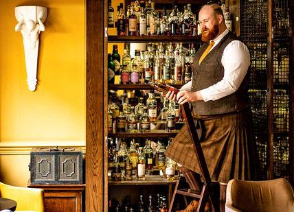 An image of a man in a bar, Journey Around Scotland' Whisky Tasting. Scotch at The Balmoral