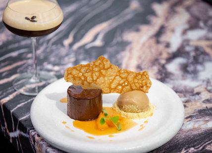 An image of a dessert and a drink, Three-Course Menu. Searcys Helix Restaurant at The Gherkin