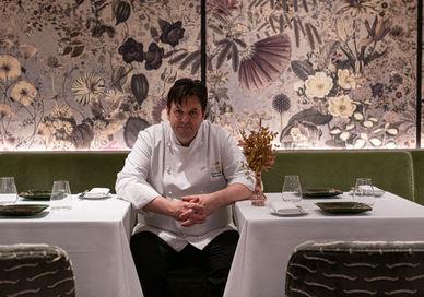An image of a man sitting at a table, Gourmand Tasting Menu. Seven Park Place by William Drabble
