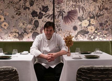 An image of a man sitting at a table, Gourmand Tasting Menu. Seven Park Place by William Drabble