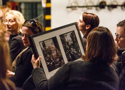 An image of a group of people with one holding a picture frame, Distillery Tour and Gin Tasting. Sipsmith Distillery