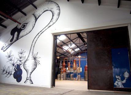 An image of a mural on the wall of a building, Sipsmith Distillery. Sipsmith Distillery