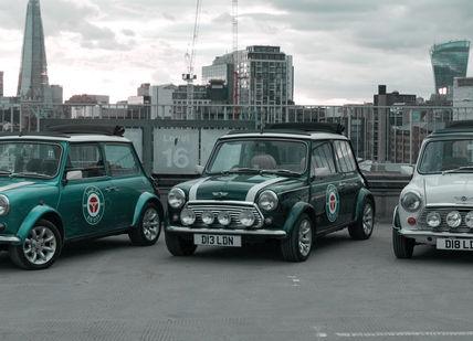 An image of three minis parked in a parking, Explore Landmarks Of London in a Classic Mini Cooper. smallcarBIGCITY