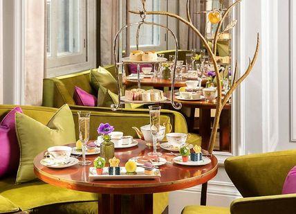 An image of a restaurant with green chairs and tables, Tea and Therapy. The Spa at Mandarin Oriental