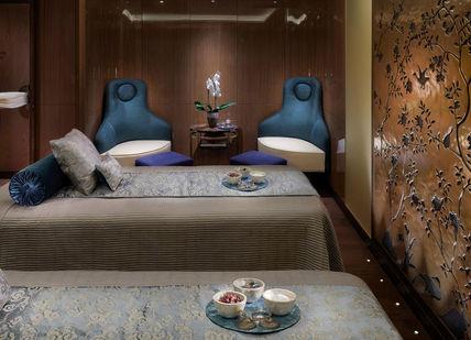 An image of a bedroom with a bed and a table, The Spa at Mandarin Oriental. The Spa at Mandarin Oriental