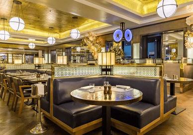 An image of a restaurant with a wooden floor, St Pancras Brasserie & Champagne Bar by Searcys. St Pancras Brasserie & Champagne Bar by Searcys