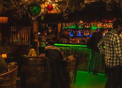 An image of a bar with people at it, Sugar Cane Bar. Sugar Cane Bar