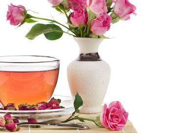 An image of a cup of tea and a vase of flowers, Private Tea Tour and Tasting with Cream Tea. T-Lovers