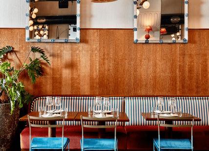 An image of a restaurant setting with a table and chairs, Dinner for two in Pizzeria Mozza, Treehouse hotel London. Treehouse Hotel London