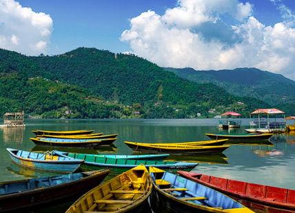 An image of boats docked in a lake, 11-Day Nepal Trekking & Jungle Safari. Trekking Guide Team Adventure