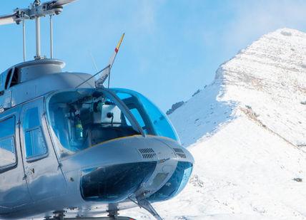 An image of a helicopter flying in the air, Private Helicopter Experience To Mount Everest Base Camp. Trekking Guide Team Adventure
