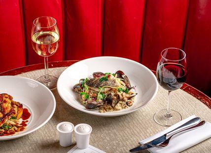 An image of two plates of food and wine, 3-Course Premium group menu. Tuttons