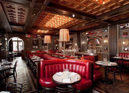 An image of a restaurant with red leather booths, Tuttons. Tuttons