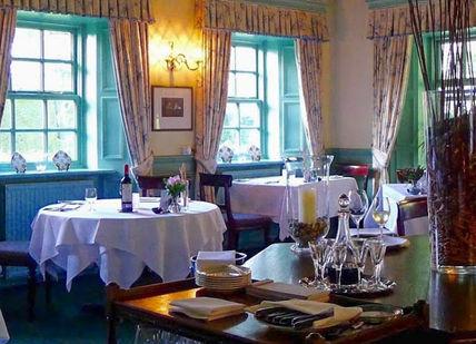 An image of a restaurant with tables and chairs, Two-Day Welsh Walking Getaway. Tyddyn Llan