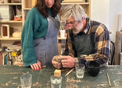 An image of a woman and man working on a piece of wood, Carving in Stone - Sculpt and Sip. Undergrounder