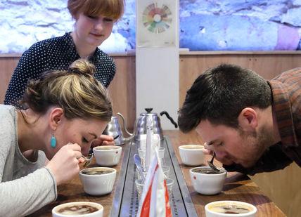 An image of a man and woman eating coffee, Introduction To Speciality Coffee. Union Brew Lab
