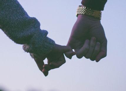 An image of a couple holding hands, Capture Your Love Story. Vandercom Films