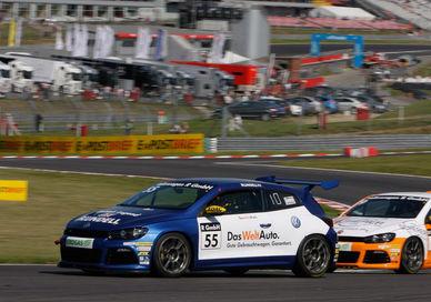 An image of two cars racing on a track, Premier motorsports class. Veloce Driving Ltd