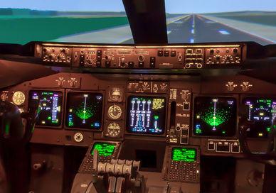 An image of a cockpit with a view of the runway, 60-minute full-motion flight simulation experience. Virtual Aerospace