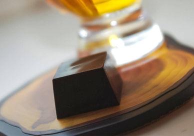 An image of a glass of beer and a chocolate bar, Whisky and Chocolate Tasting. Whiski Rooms