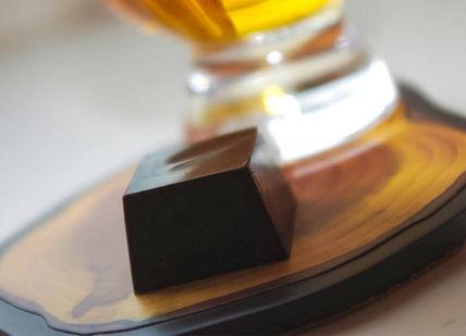 An image of a glass of beer and a chocolate bar, Whisky and Chocolate Tasting. Whiski Rooms